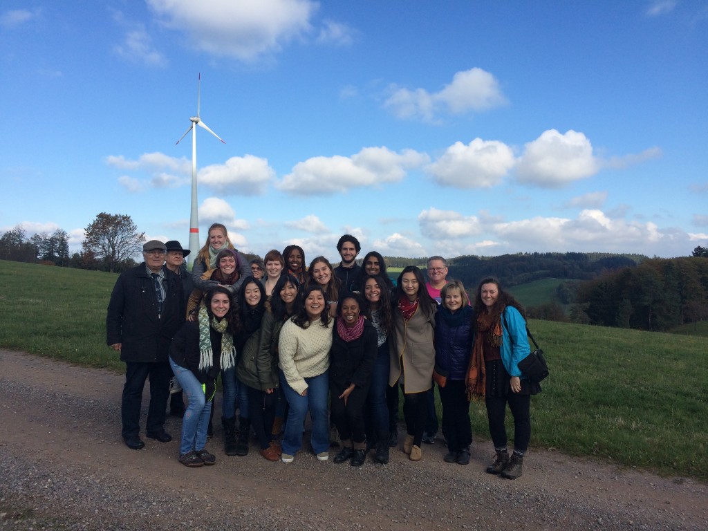 Class photo in front of a windmill and blue skies