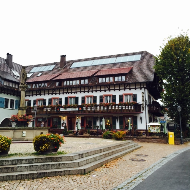 Square with central fountain and traditional German buildings